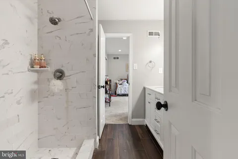 a bathroom with a toilet sink and shower