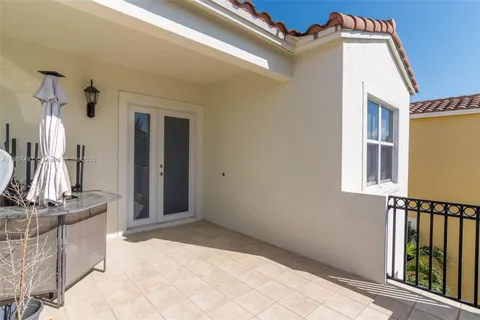 a view of balcony with furniture
