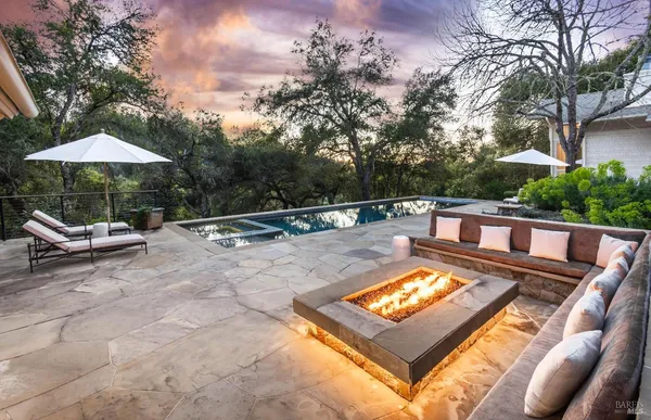 a view of a swimming pool with a patio
