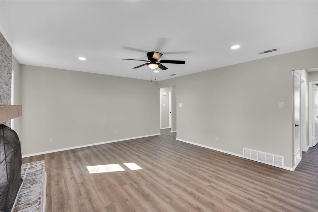 221 North Edgefield Road Waxahachie, TX 75165 - Photo 22 of 27 wooden floor in an empty room with a window