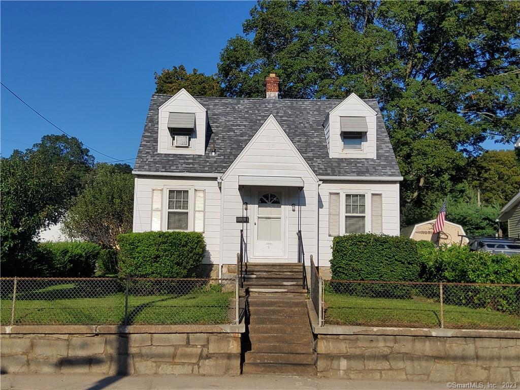 580 Frost Road Waterbury, CT 06705 - Photo 1 of 1 a front view of a house with a yard