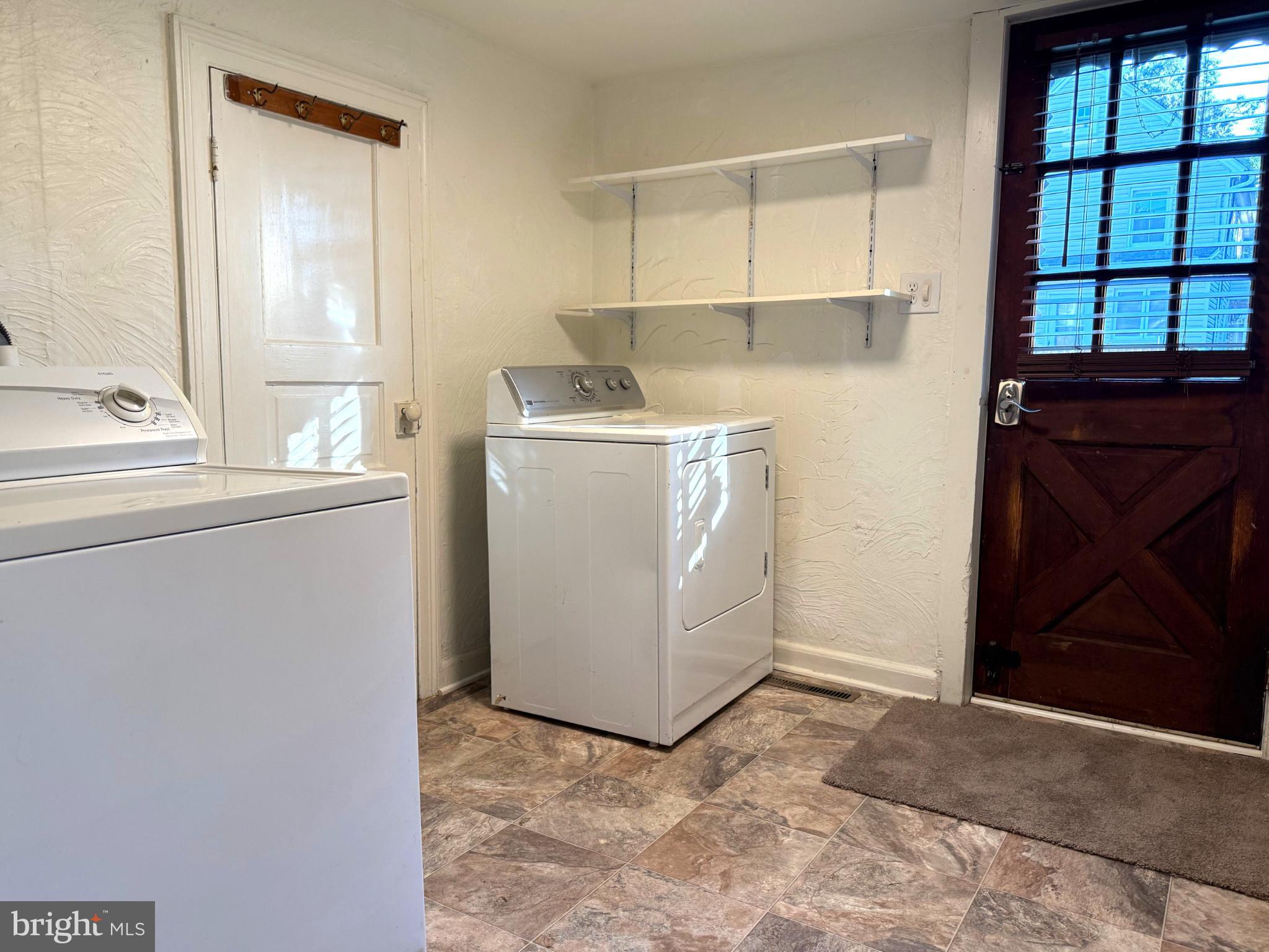 61 West W Pitman, NJ 08071 - Photo 2 of 9 a view of storage and utility room with washer and dryer