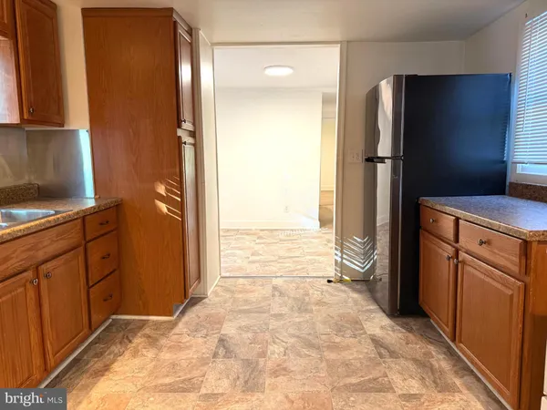 a view of a kitchen with appliances and cabinets