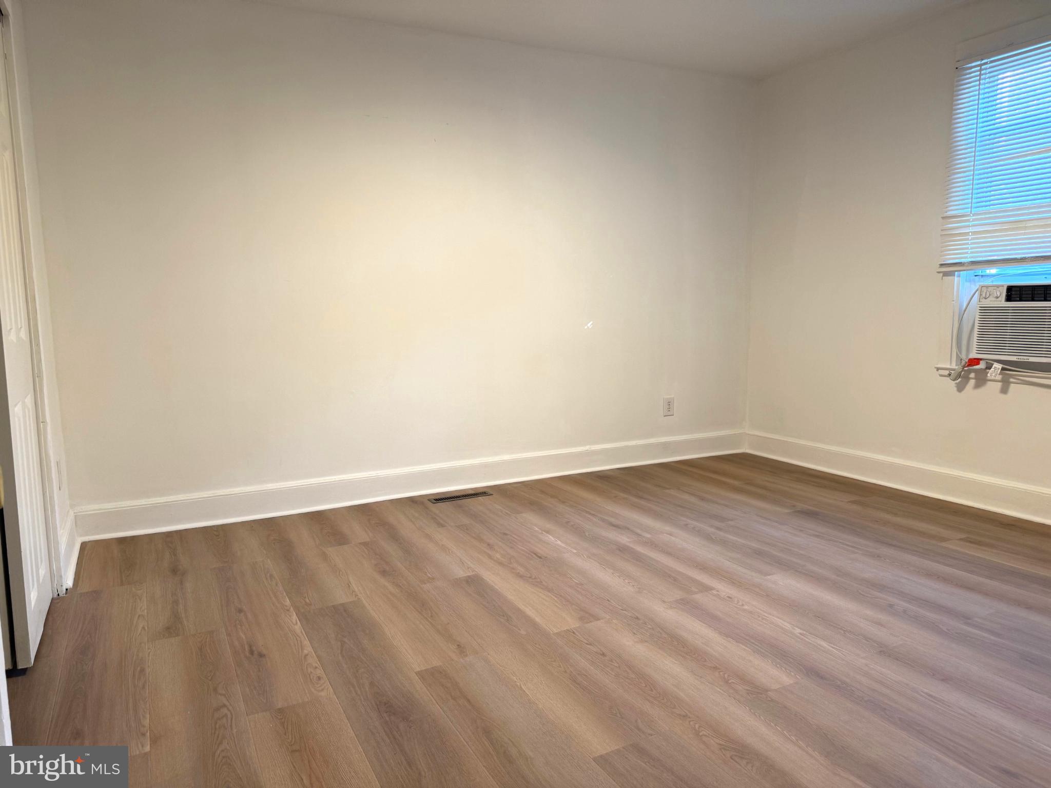 61 West W Pitman, NJ 08071 - Photo 9 of 9 a view of an empty room with wooden floor
