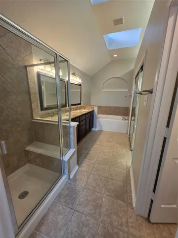 a bathroom with a tub and a shower