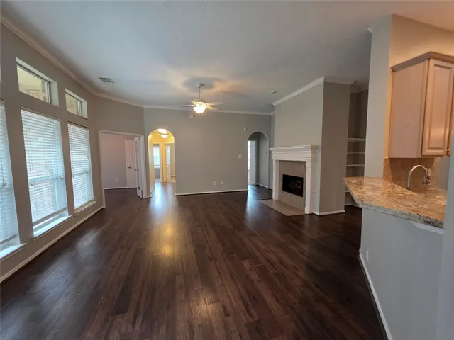 a view of a kitchen with a sink and a fireplace
