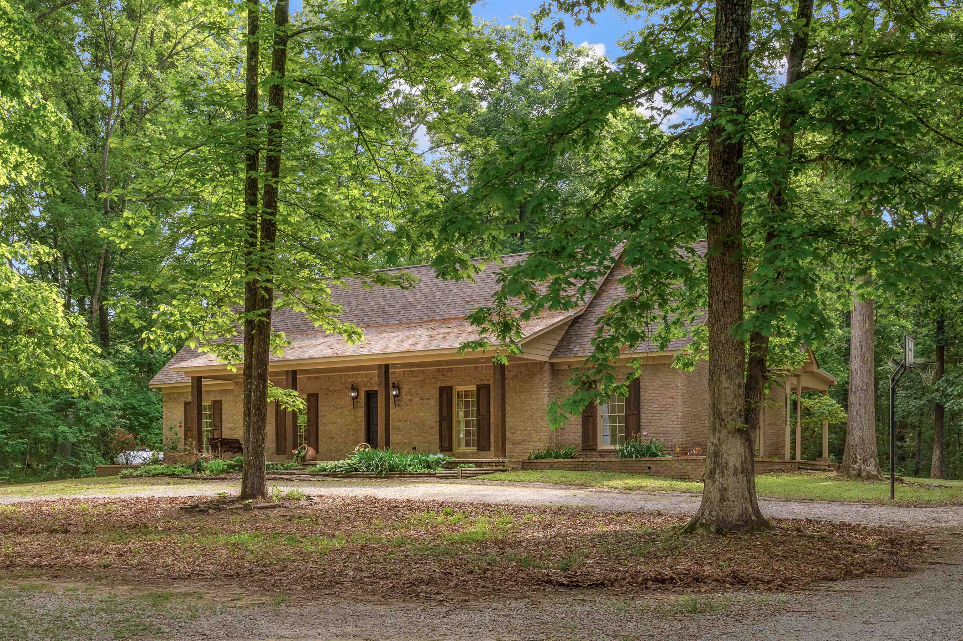 4020 Price Road Moscow, TN 38057 - Photo 1 of 35 View of front facade featuring brick siding, roof with shingles, and covered porch