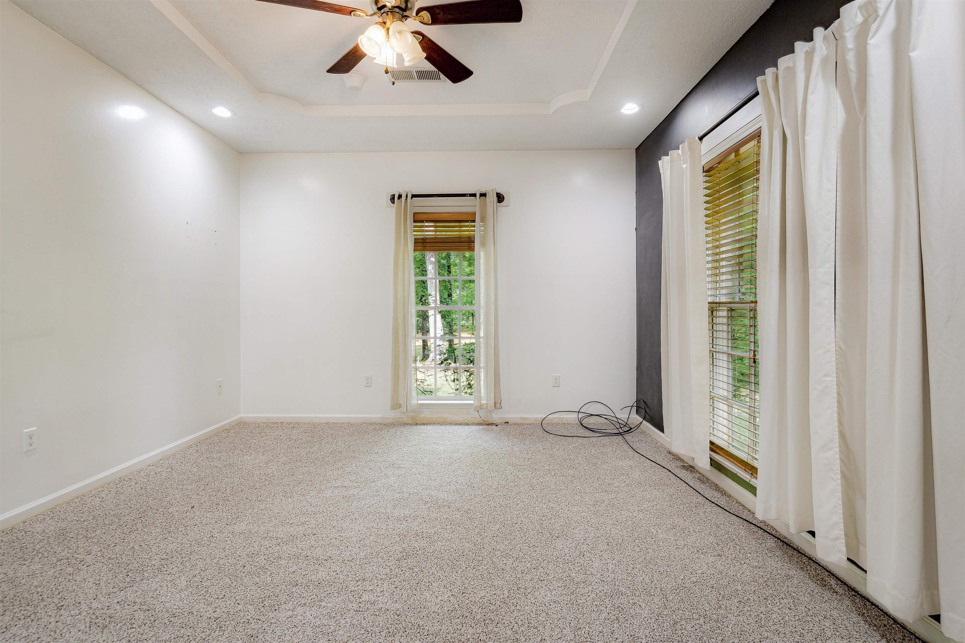 4020 Price Road Moscow, TN 38057 - Photo 20 of 35 Empty room featuring ceiling fan, visible vents, carpet, a tray ceiling, and recessed lighting