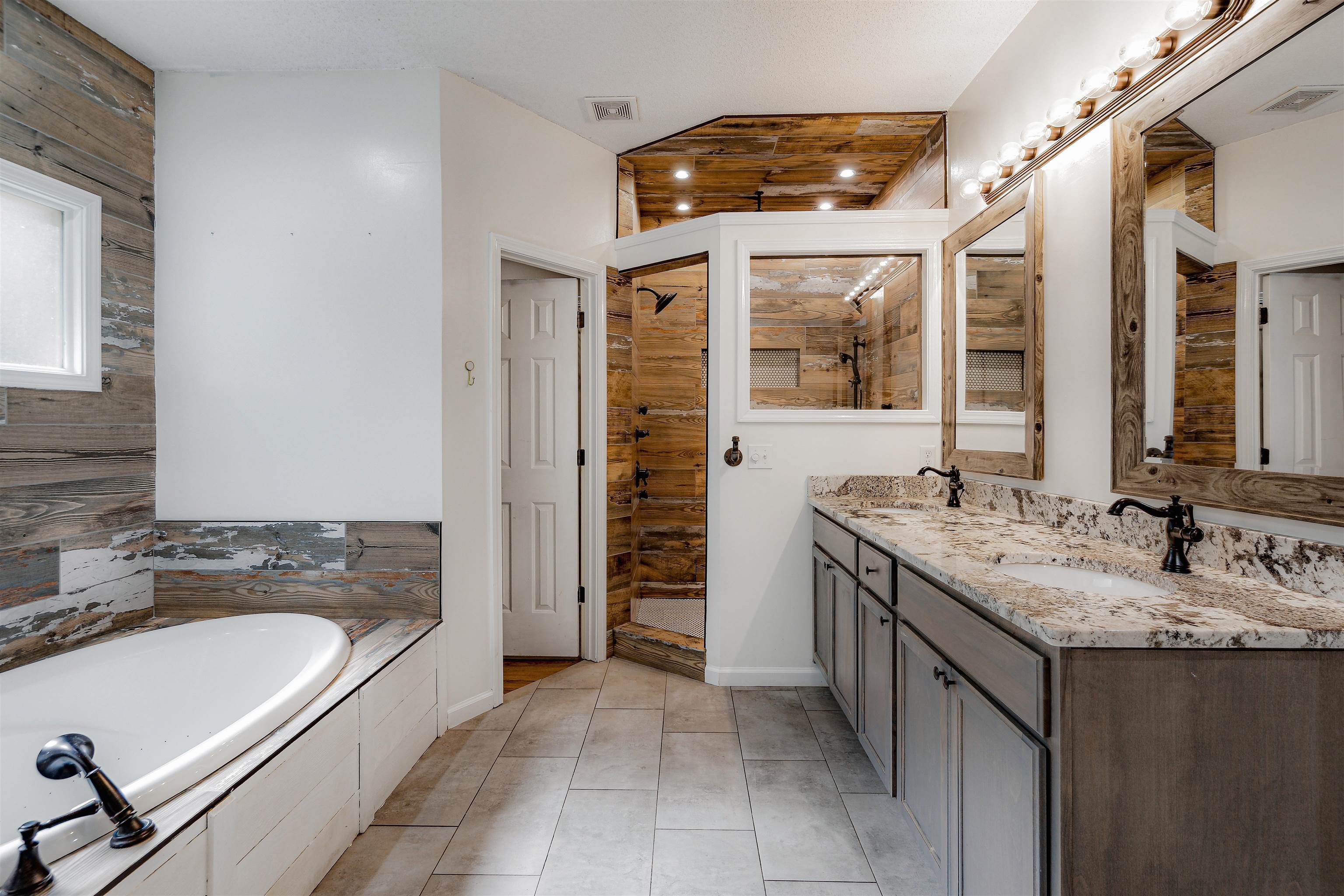 4020 Price Road Moscow, TN 38057 - Photo 21 of 35 Full bathroom featuring tiled shower, visible vents, a sink, and a bath