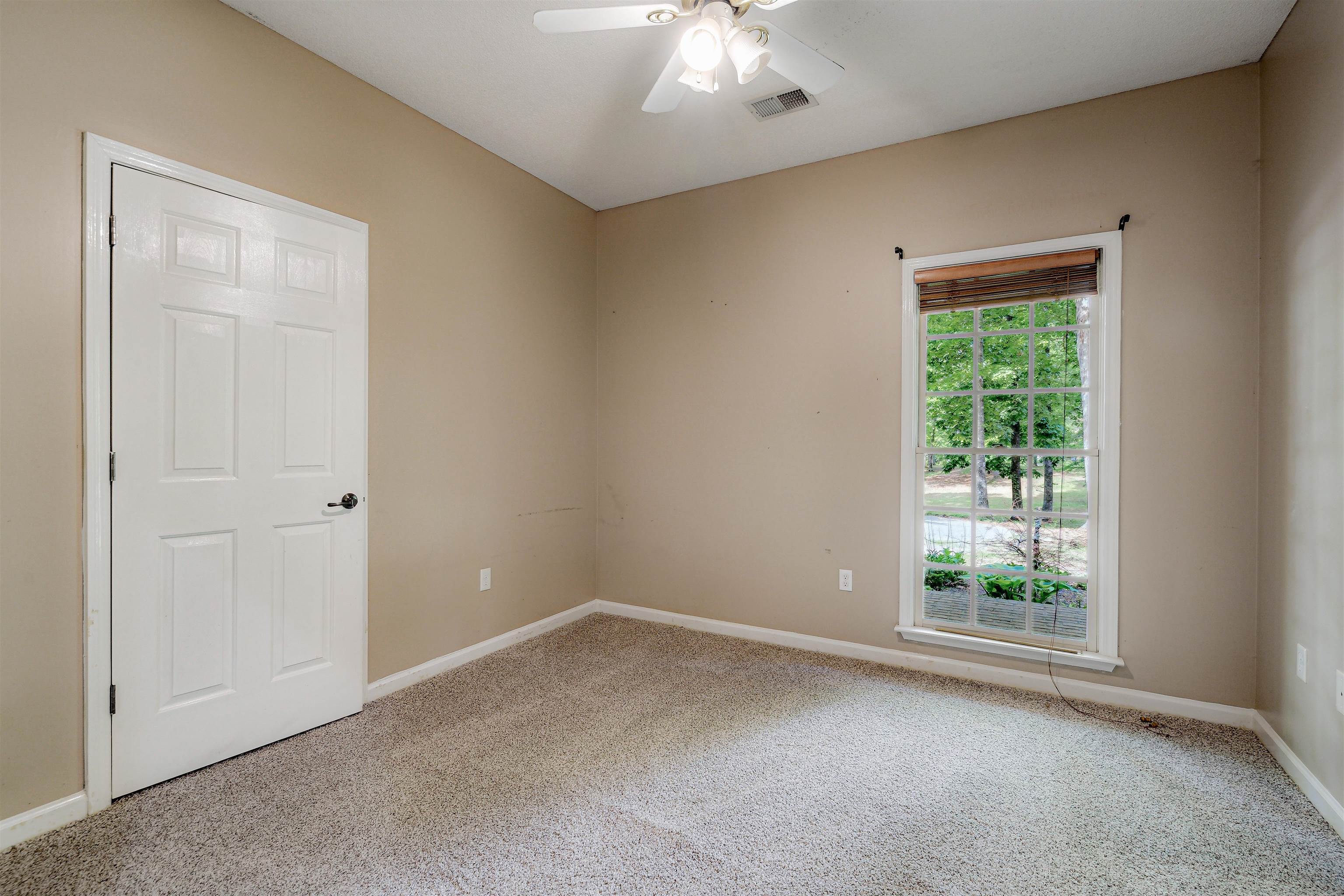 4020 Price Road Moscow, TN 38057 - Photo 23 of 35 Spare room featuring baseboards, a ceiling fan, carpet flooring, and visible vents