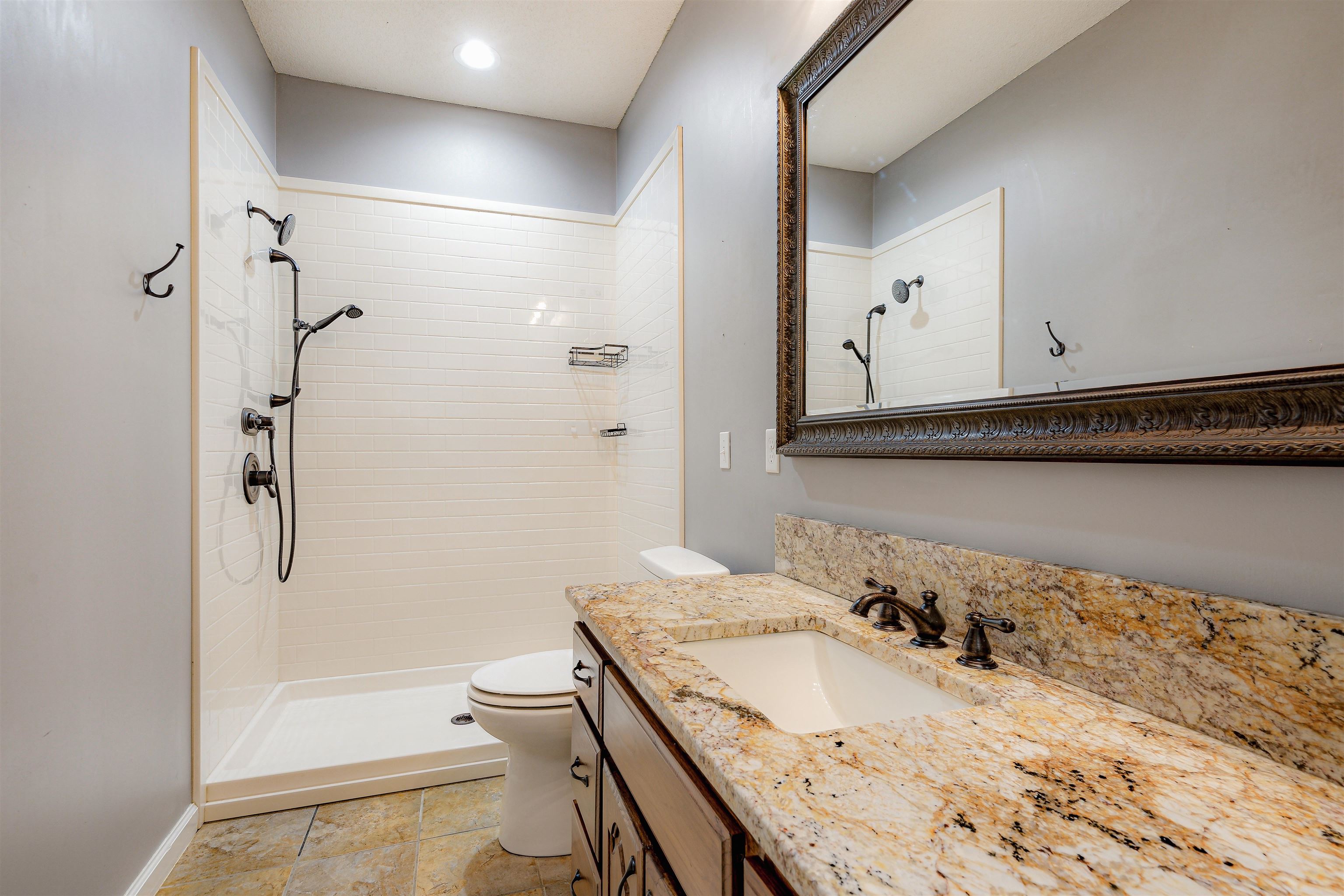 4020 Price Road Moscow, TN 38057 - Photo 25 of 35 Bathroom featuring vanity, toilet, and tiled shower