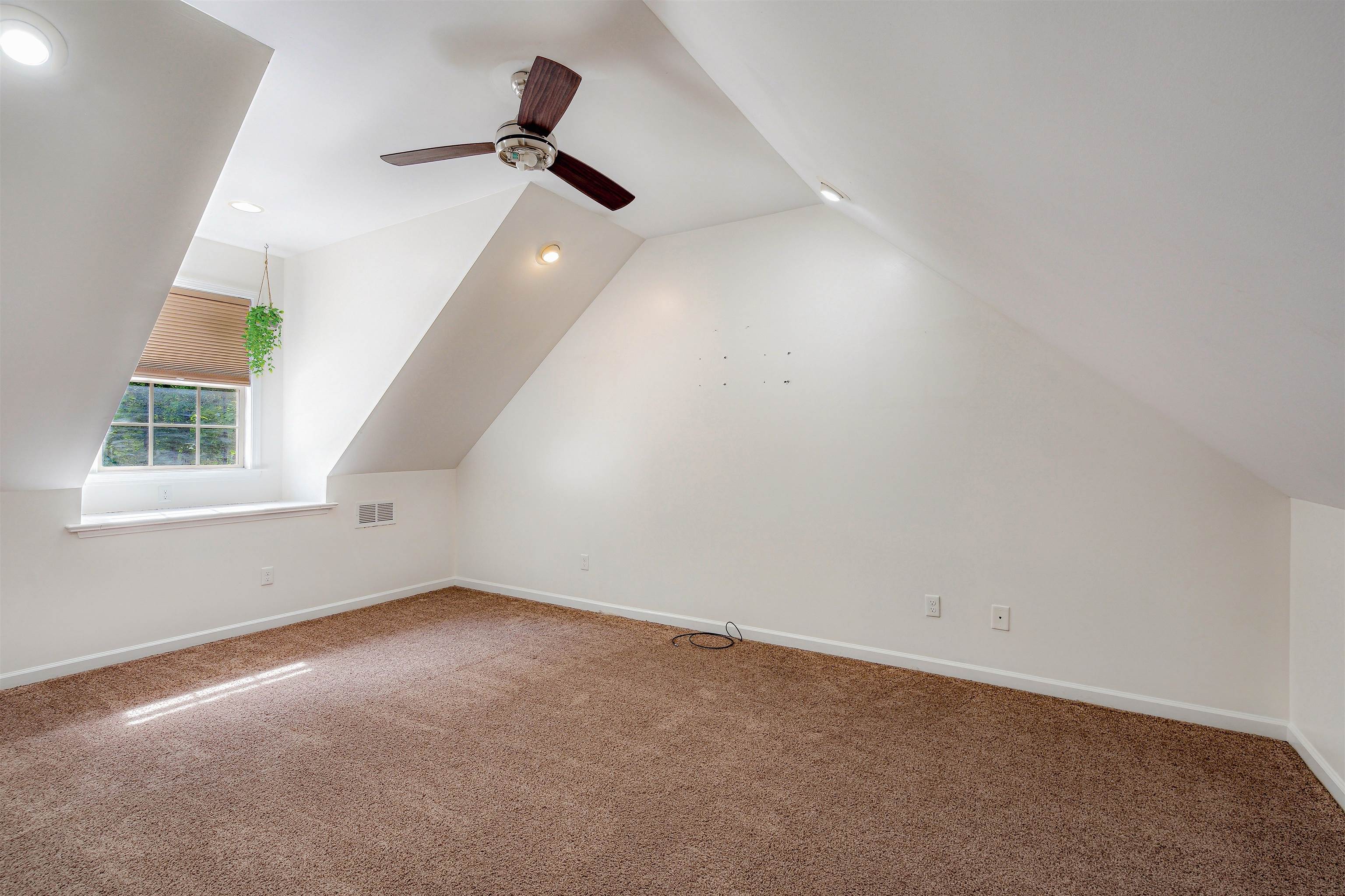 4020 Price Road Moscow, TN 38057 - Photo 26 of 35 Additional living space featuring visible vents, carpet floors, vaulted ceiling, and ceiling fan