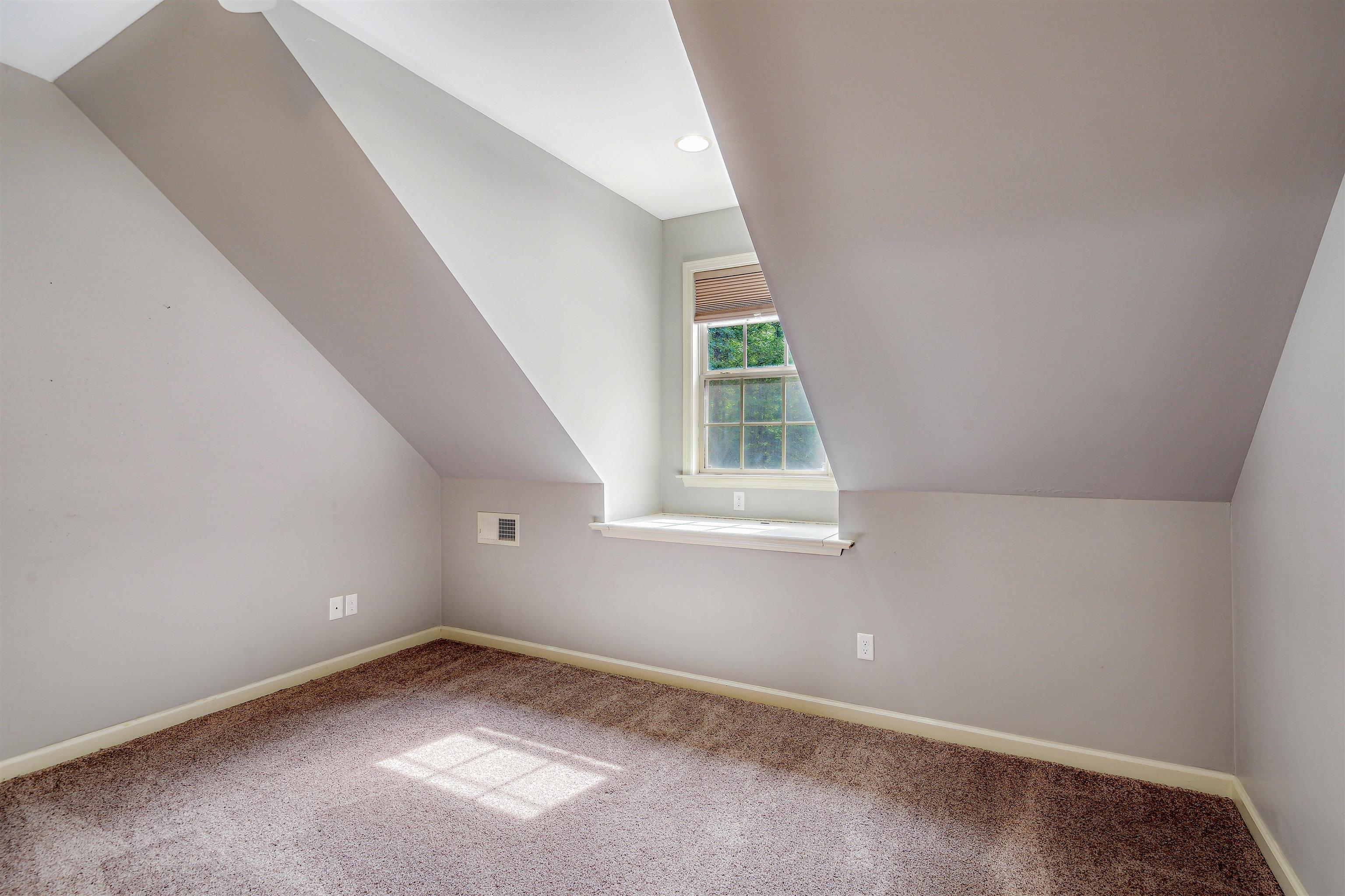 4020 Price Road Moscow, TN 38057 - Photo 27 of 35 Additional living space featuring carpet floors, baseboards, visible vents, and vaulted ceiling
