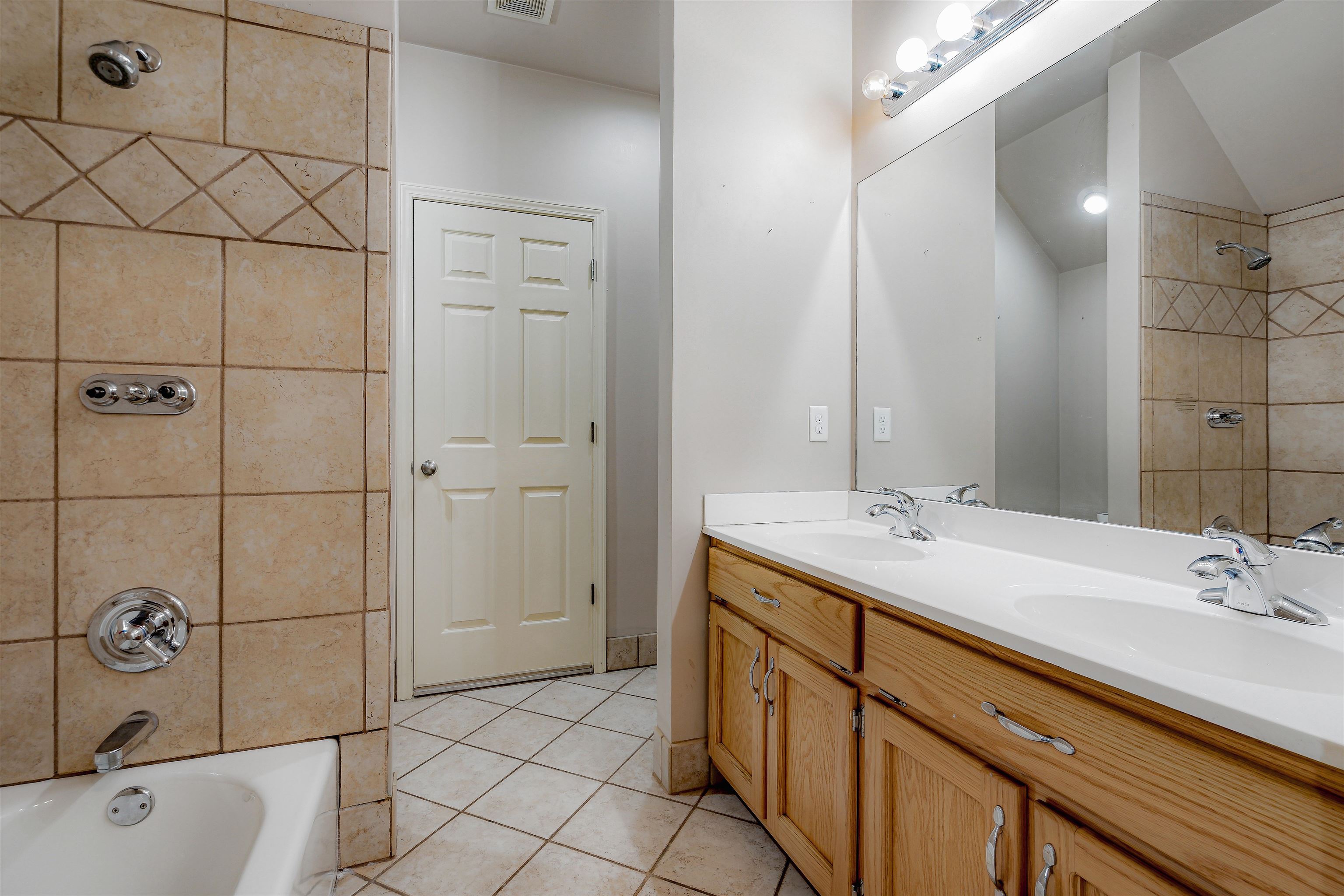 4020 Price Road Moscow, TN 38057 - Photo 29 of 35 Full bath featuring shower / bathtub combination, visible vents, a sink, and tile patterned flooring