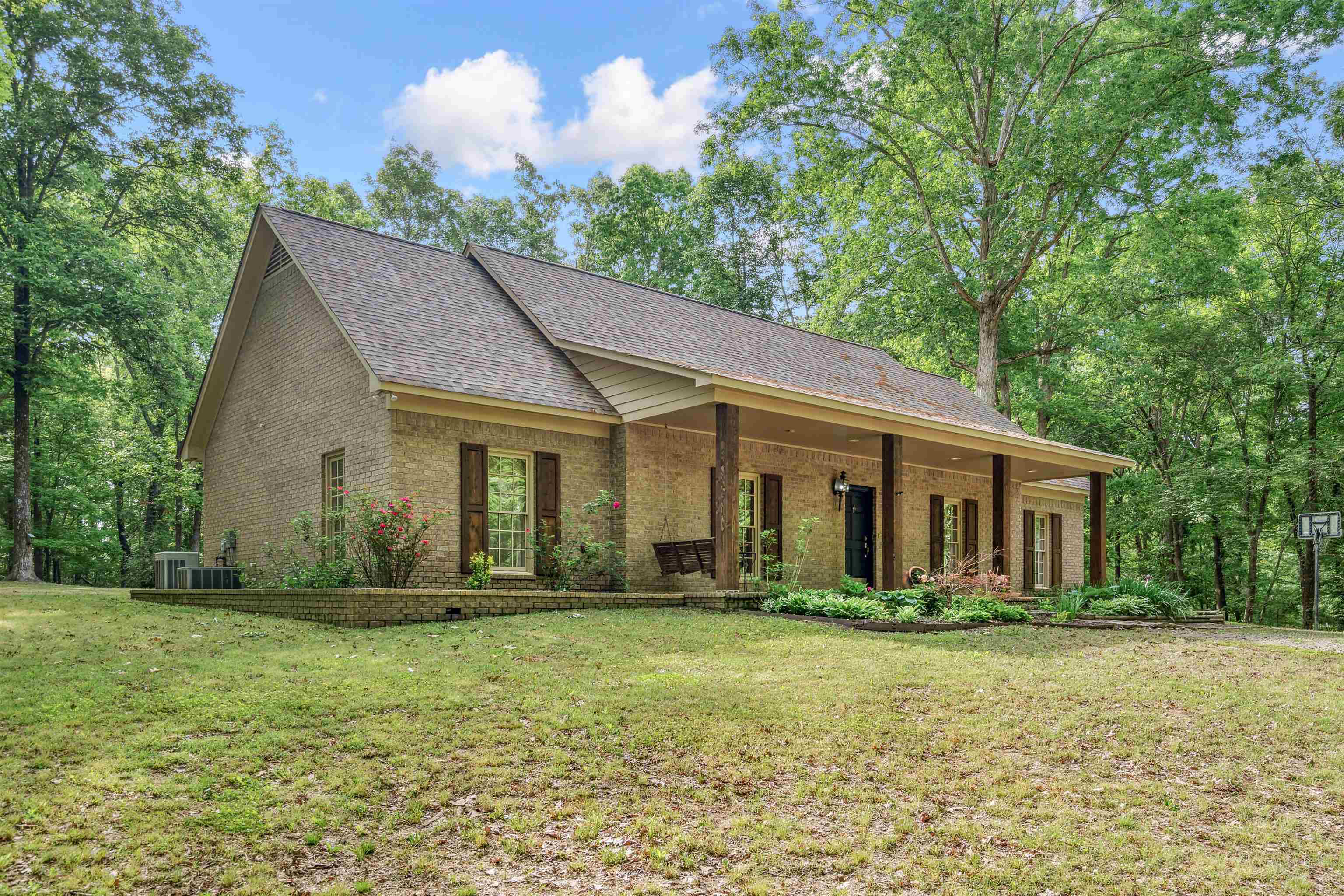 4020 Price Road Moscow, TN 38057 - Photo 4 of 35 Ranch-style home with brick siding, a shingled roof, central air condition unit, and a front yard
