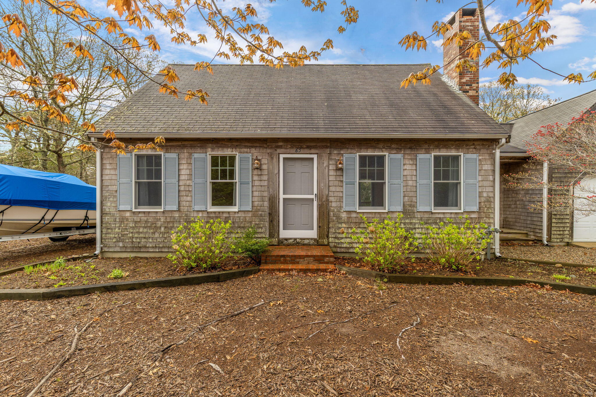 65 Whitney Road Eastham, MA 02642 - Photo 4 of 41 a front view of a house with garden