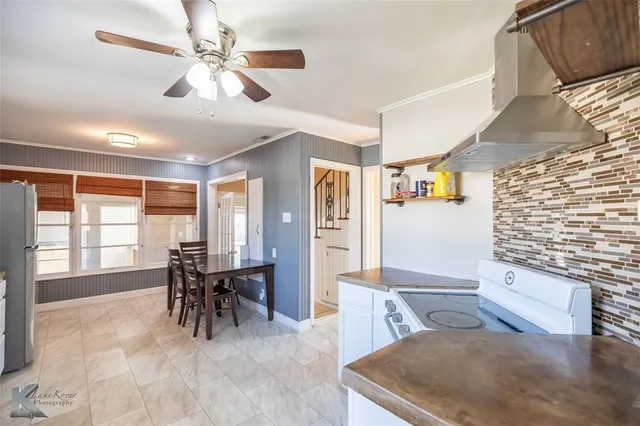 a living room with furniture and white walls