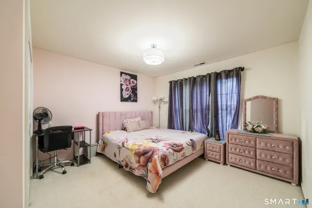 a bedroom with a bed and furniture