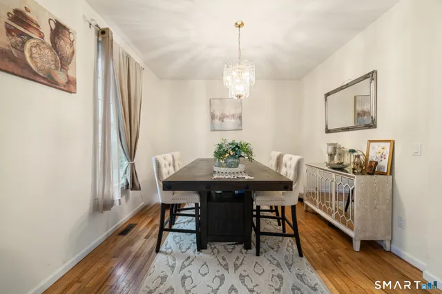a view of a dining room with furniture