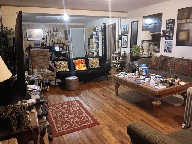 a living room with furniture and a table