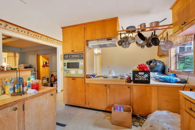 a kitchen with a sink and cabinets