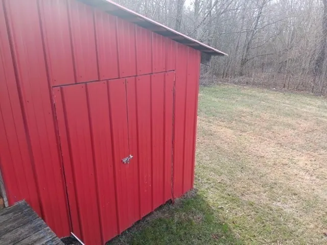 a kitchen with refrigerator and cabinets