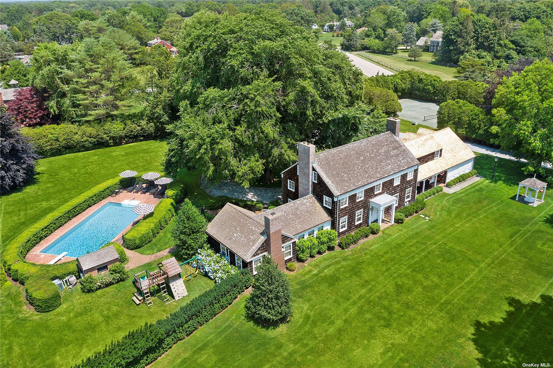 104 South Country Road Remsenburg, NY 11960 - Photo 1 of 1 an aerial view of a house with garden space and street view