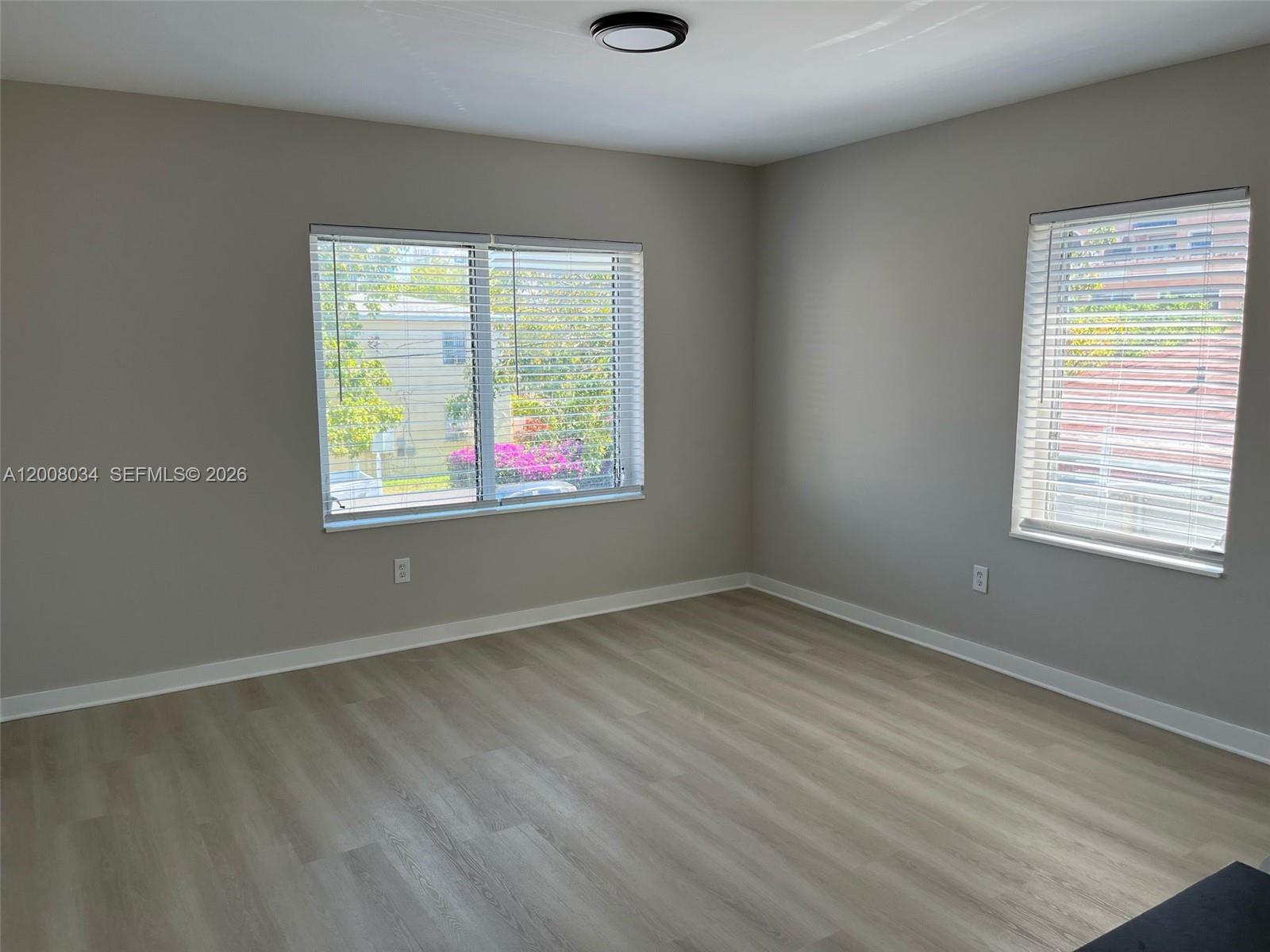 534 Southwest 6th Court, Unit 1 Miami, FL 33130 - Photo 8 of 10 an empty room with a window