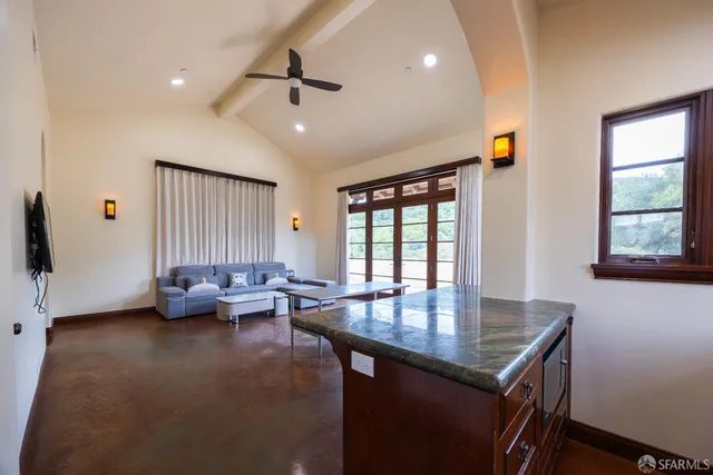 a living room with furniture and a window