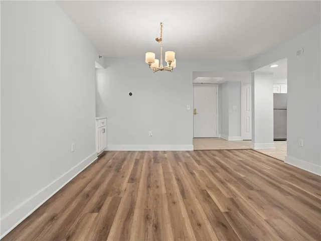 a view of a room with wooden floor and mountain view