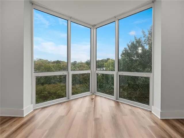 a bathroom with a granite countertop toilet and a sink