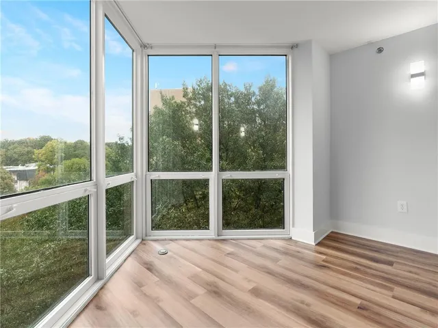 a bathroom with a granite countertop sink a toilet and shower