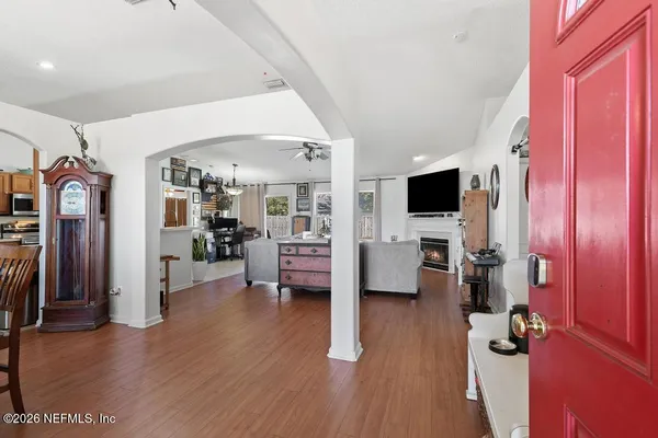a living room with furniture and a flat screen tv
