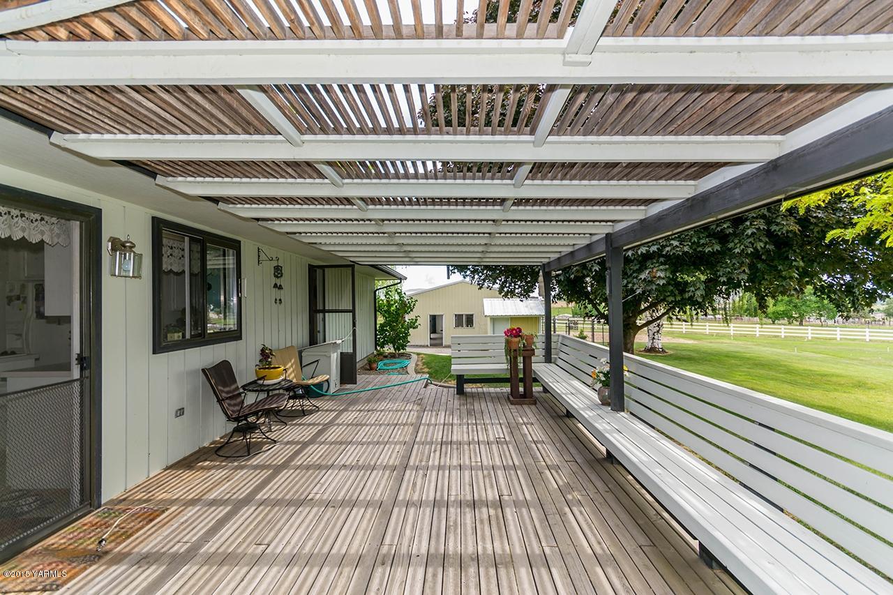 9530 Bittner Road Yakima, WA 98901 - Photo 10 of 28 a view of a patio with swimming pool table and chairs