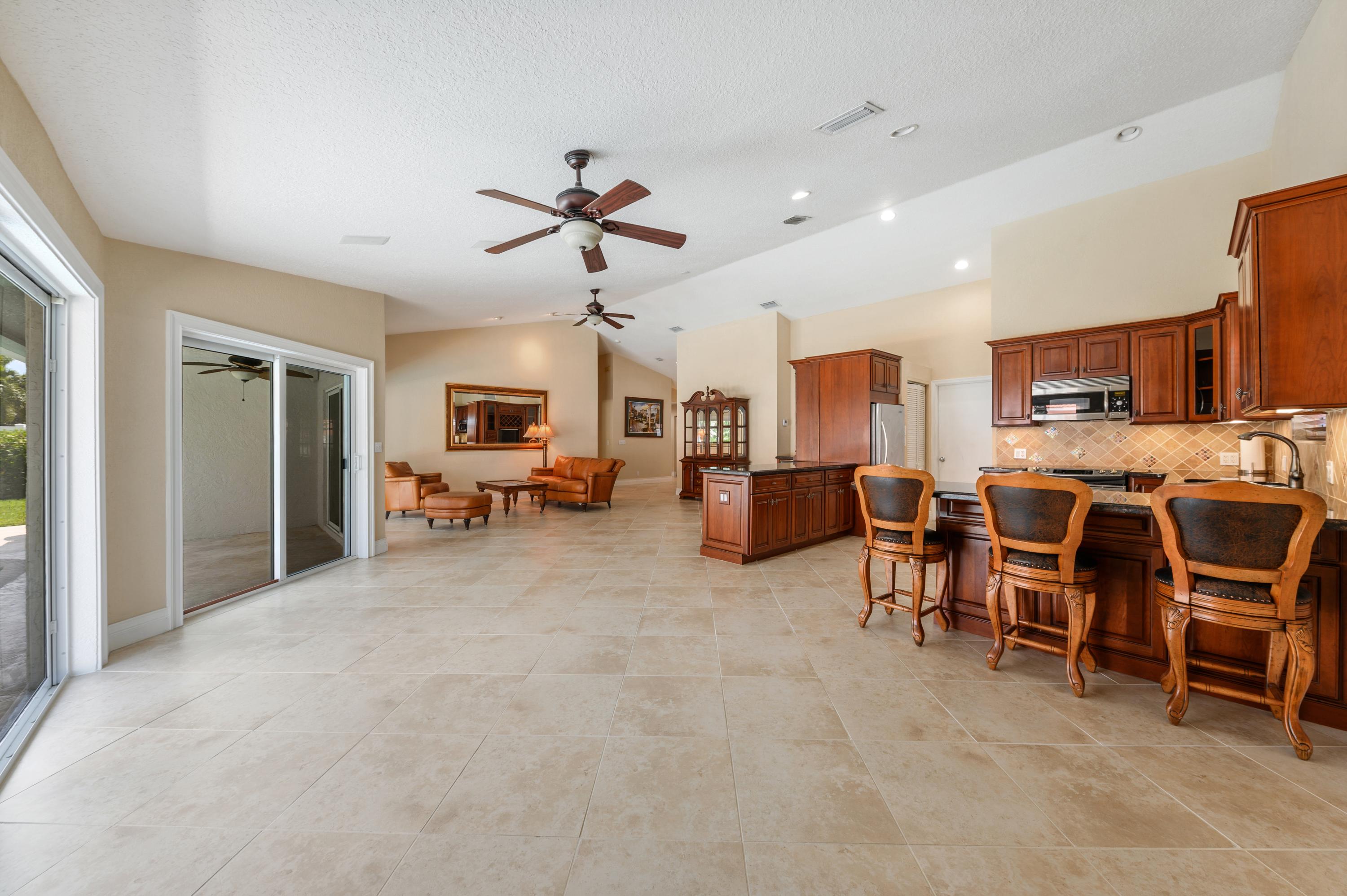 361 Apache Lane Boca Raton, FL 33487 - Photo 4 of 17 03_361ApacheLane_93001_LivingRoomDiningR