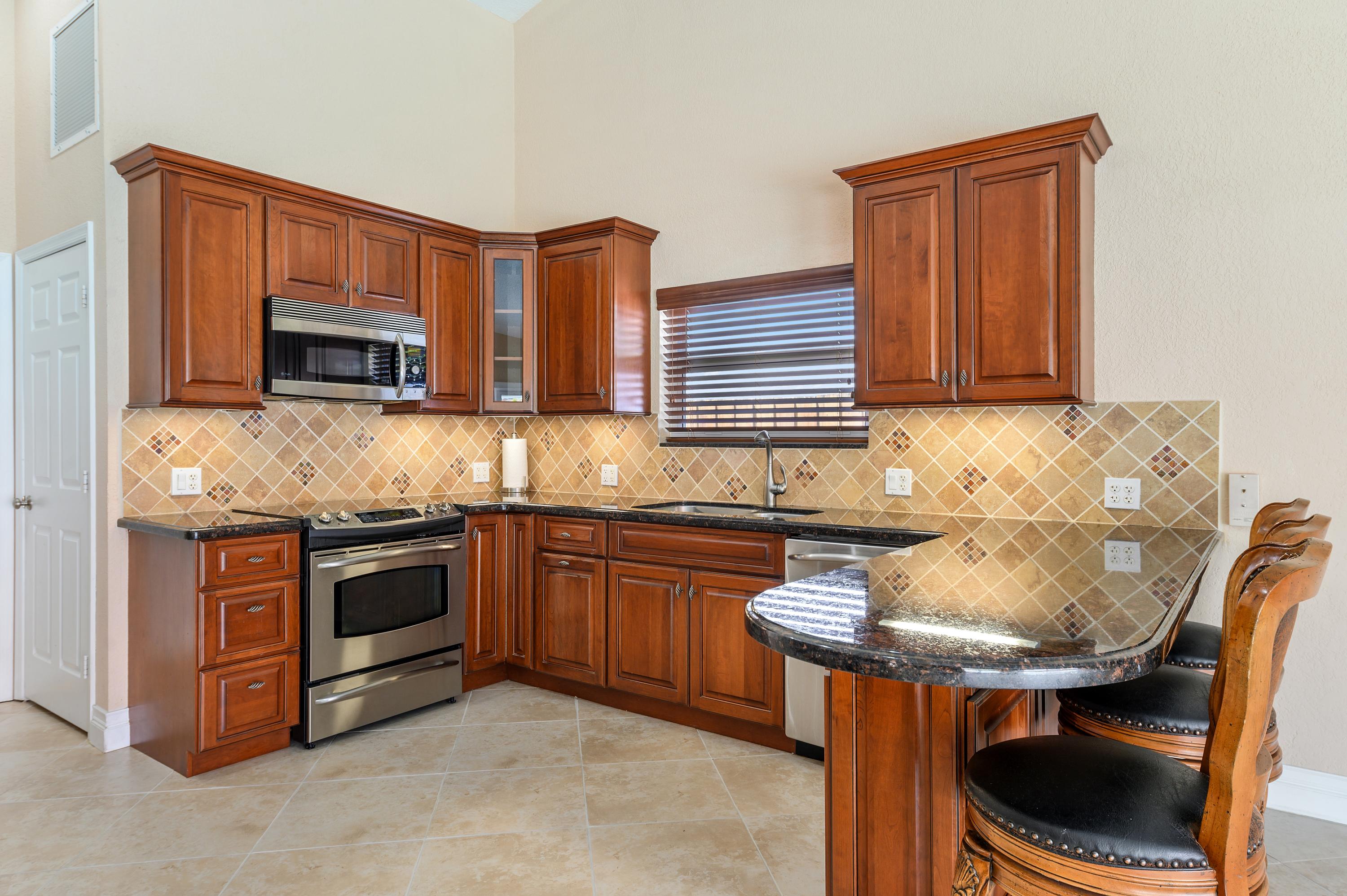 361 Apache Lane Boca Raton, FL 33487 - Photo 5 of 17 04_361ApacheLane_5_Kitchen_HiRes