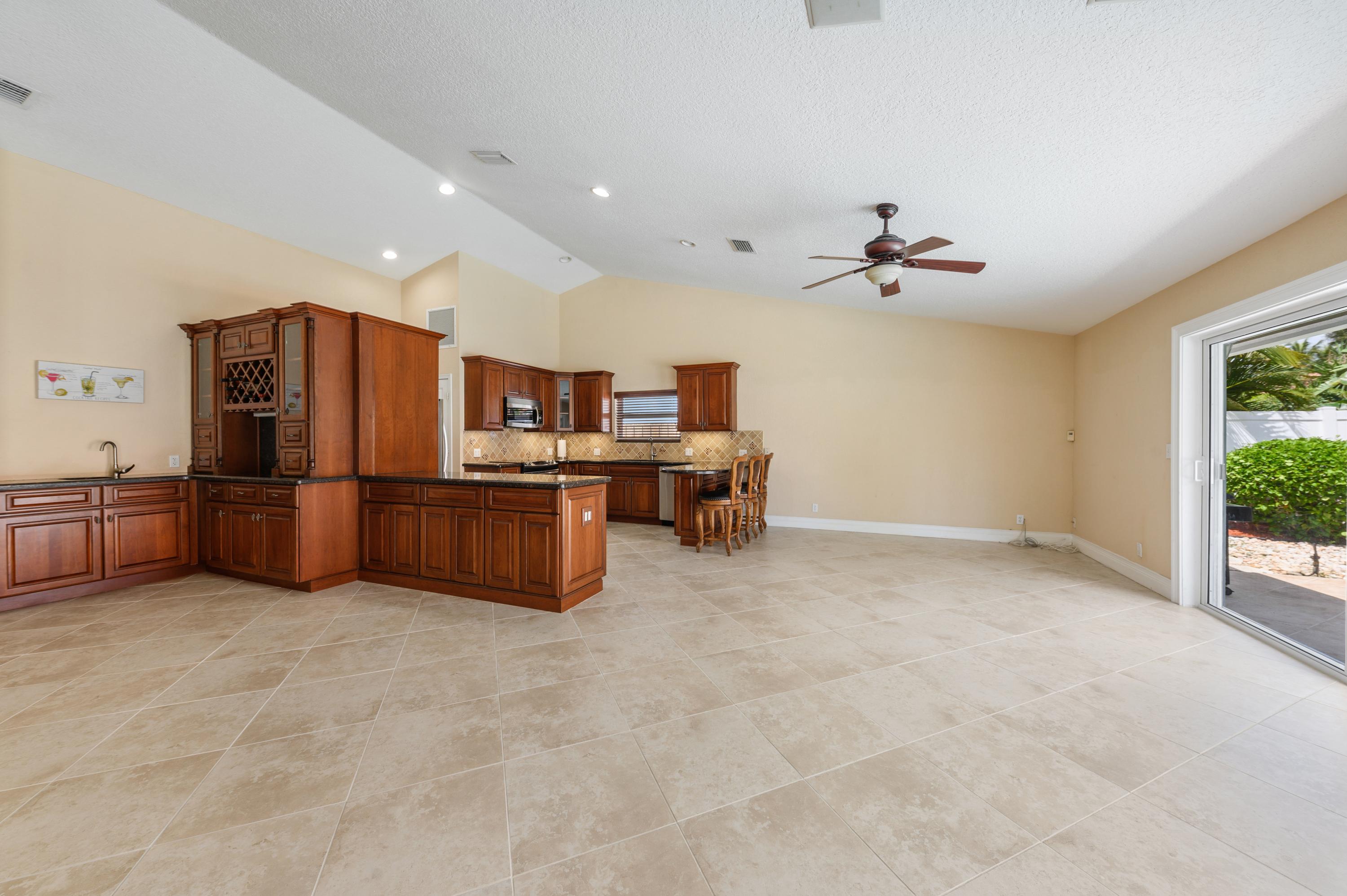 361 Apache Lane Boca Raton, FL 33487 - Photo 6 of 17 05_361ApacheLane_92_KitchenDiningRoom_Hi