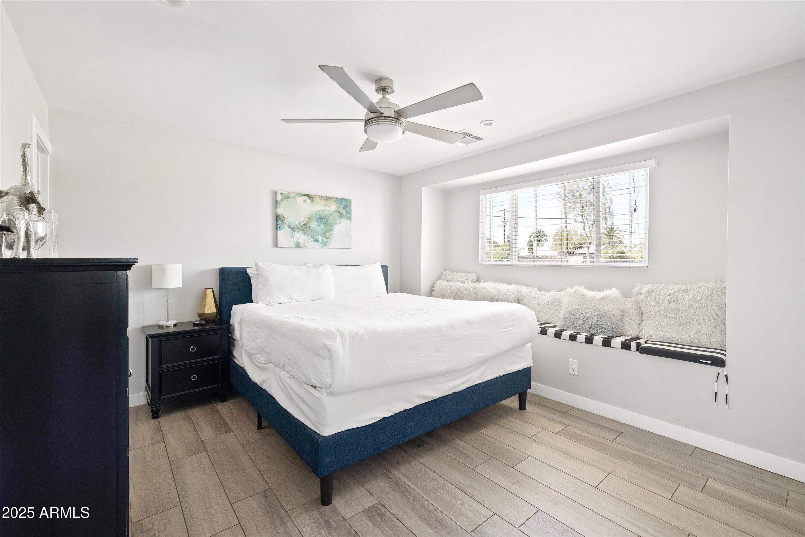 8201 East Piccadilly Road Scottsdale, AZ 85251 - Photo 15 of 26 a bedroom with a bed and window