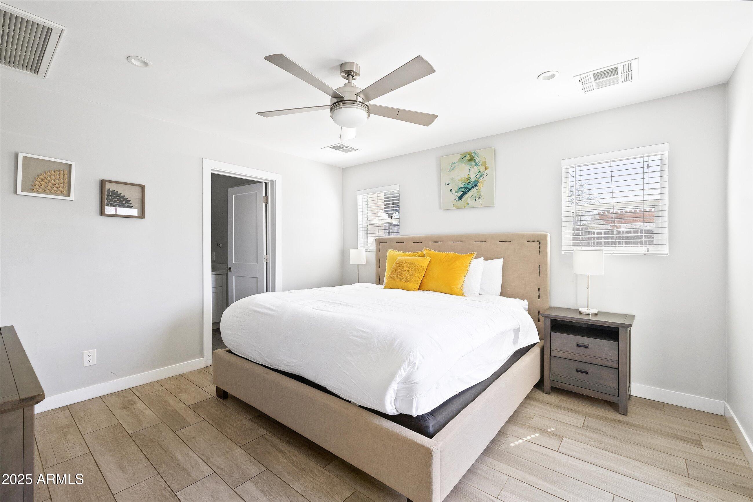 8201 East Piccadilly Road Scottsdale, AZ 85251 - Photo 20 of 26 a bedroom with a bed and window