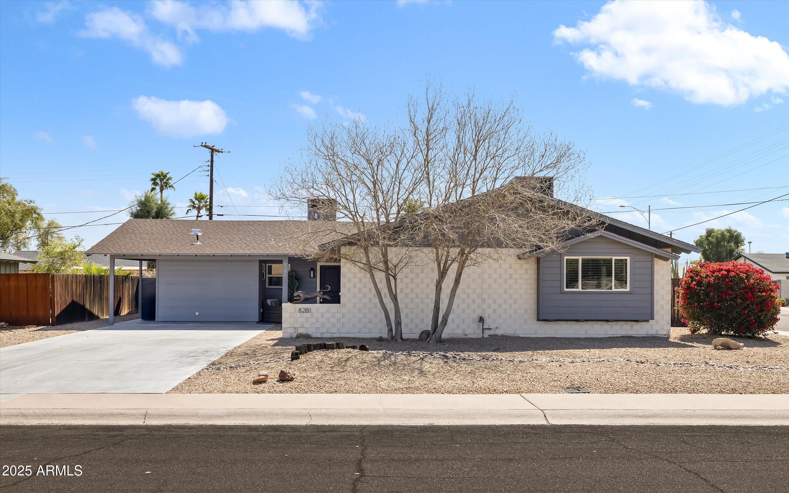 8201 East Piccadilly Road Scottsdale, AZ 85251 - Photo 2 of 26 a view of a house with a yard