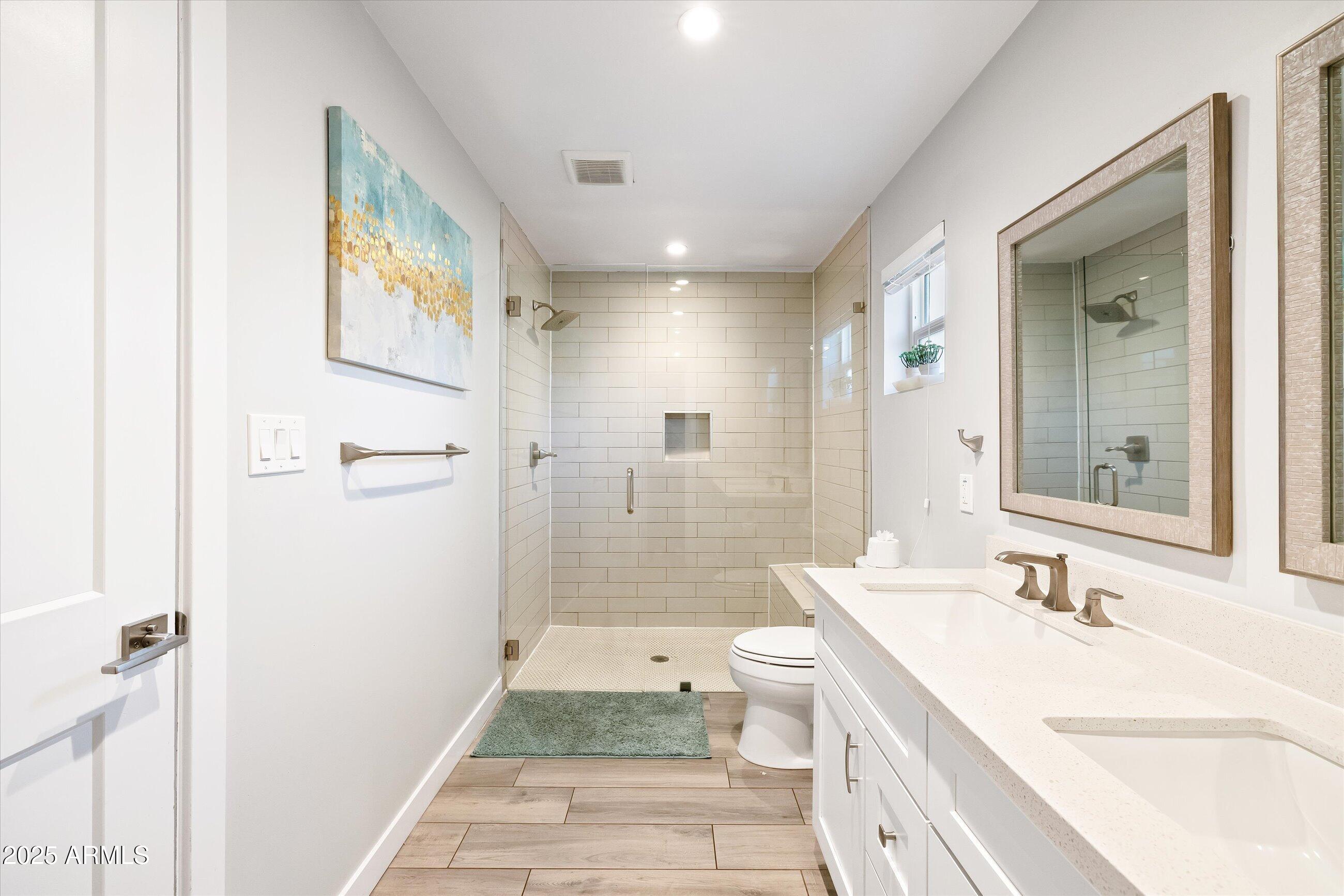 8201 East Piccadilly Road Scottsdale, AZ 85251 - Photo 23 of 26 a bathroom with a granite countertop sink toilet and shower