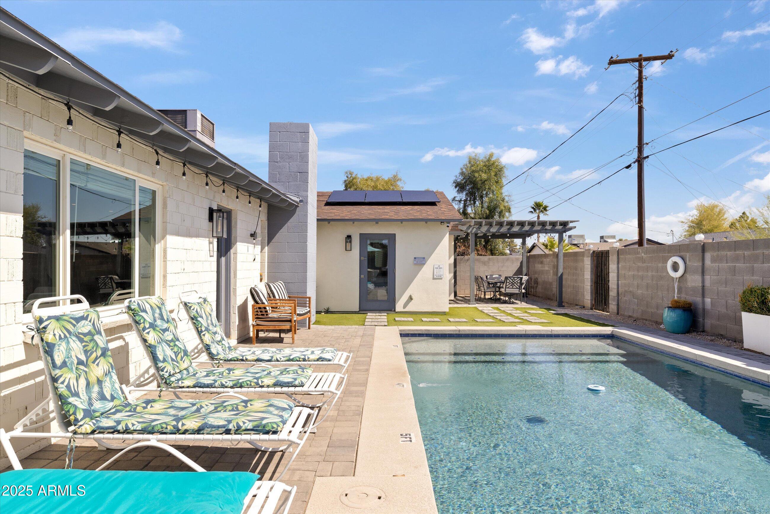 8201 East Piccadilly Road Scottsdale, AZ 85251 - Photo 24 of 26 a view of a house with swimming pool
