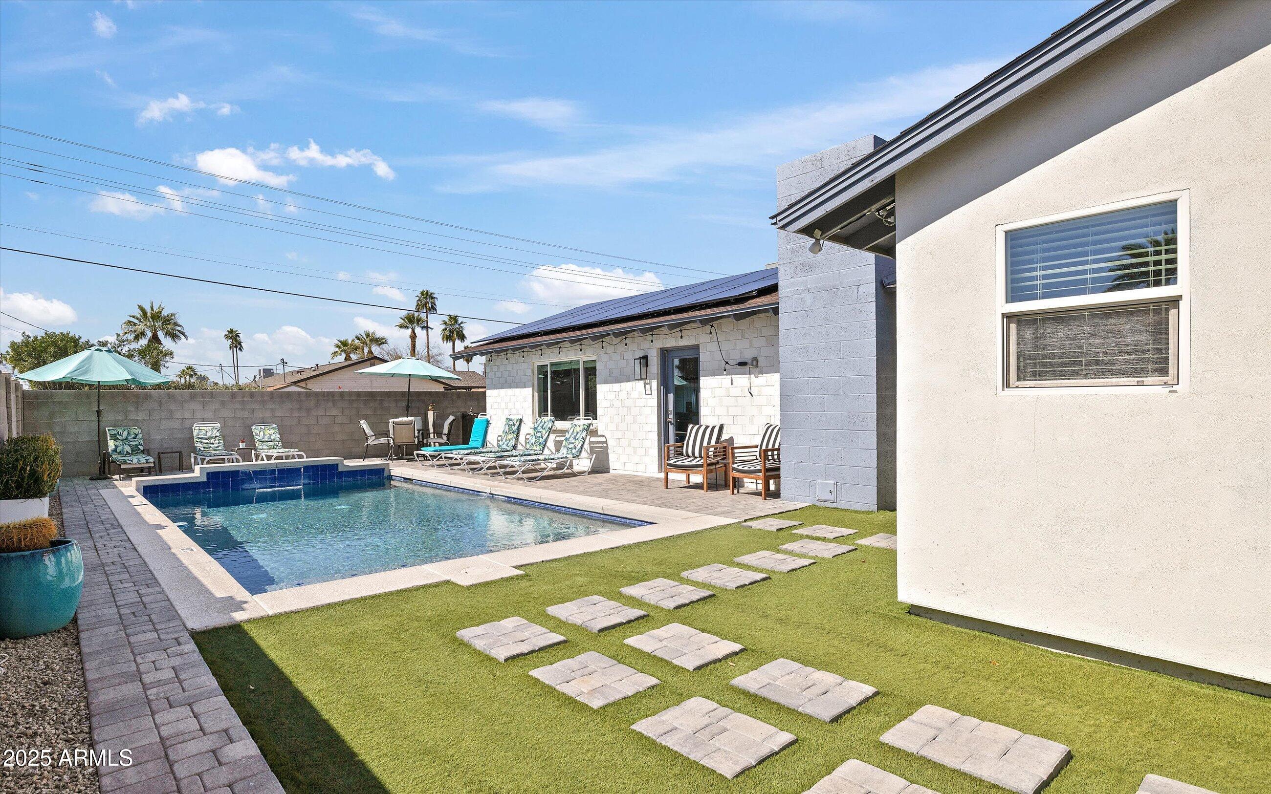 8201 East Piccadilly Road Scottsdale, AZ 85251 - Photo 25 of 26 a view of a backyard with table and chairs