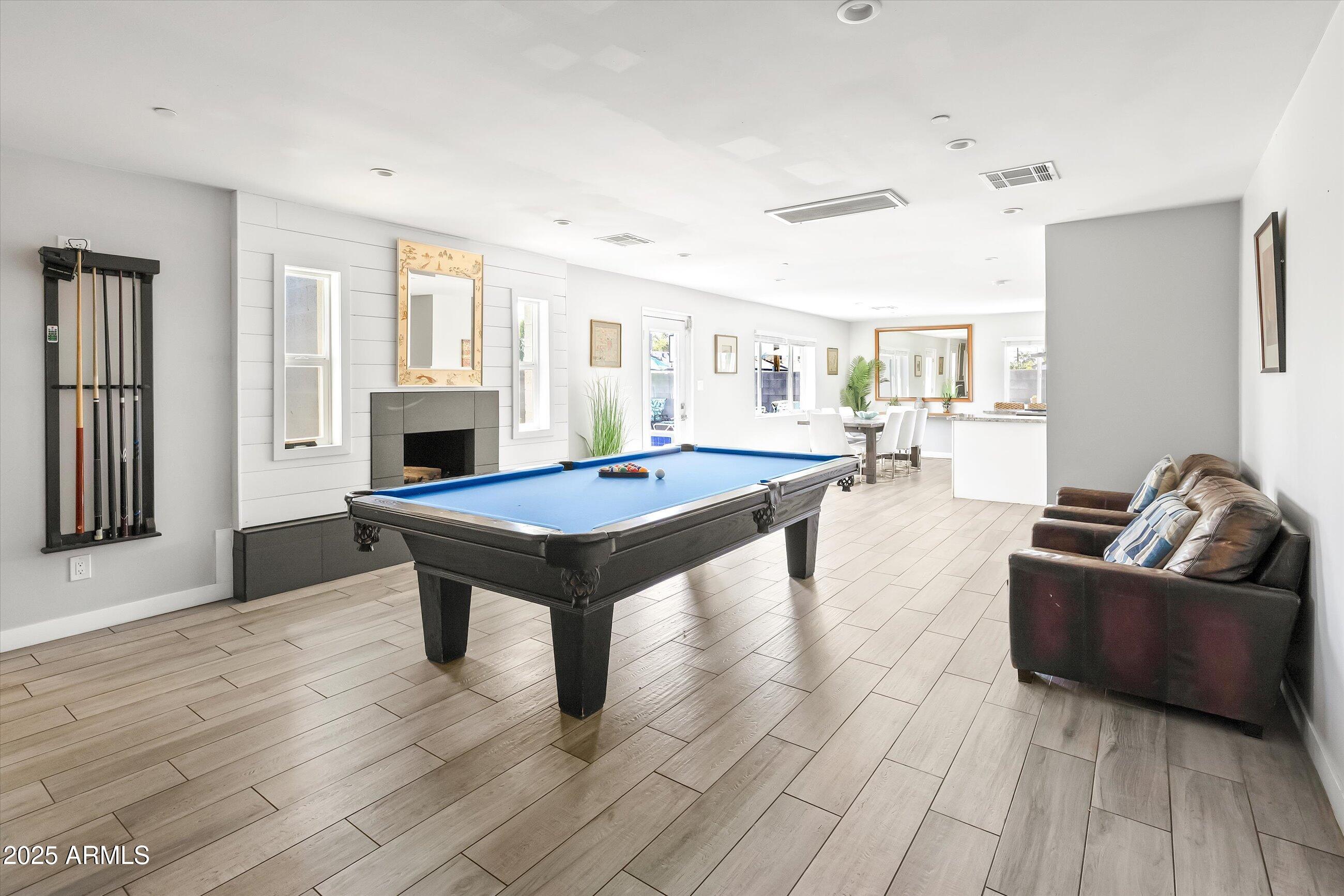 8201 East Piccadilly Road Scottsdale, AZ 85251 - Photo 6 of 26 a living room with furniture and a wooden floor