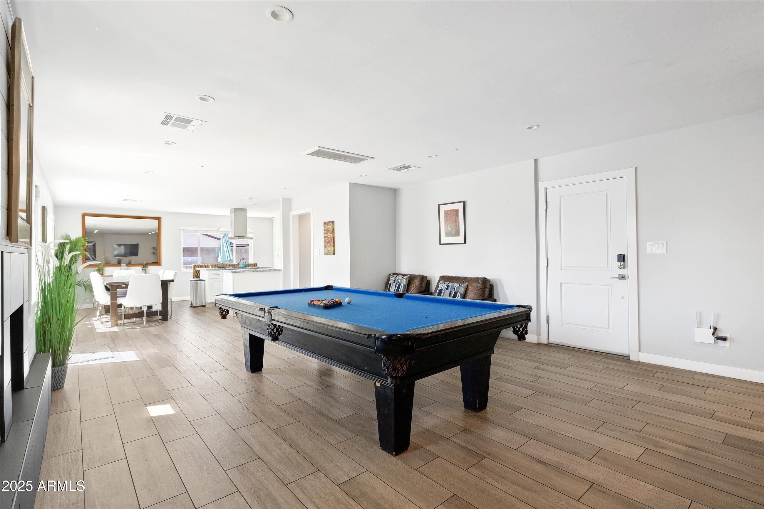 8201 East Piccadilly Road Scottsdale, AZ 85251 - Photo 7 of 26 a room with furniture pool table and flat screen tv