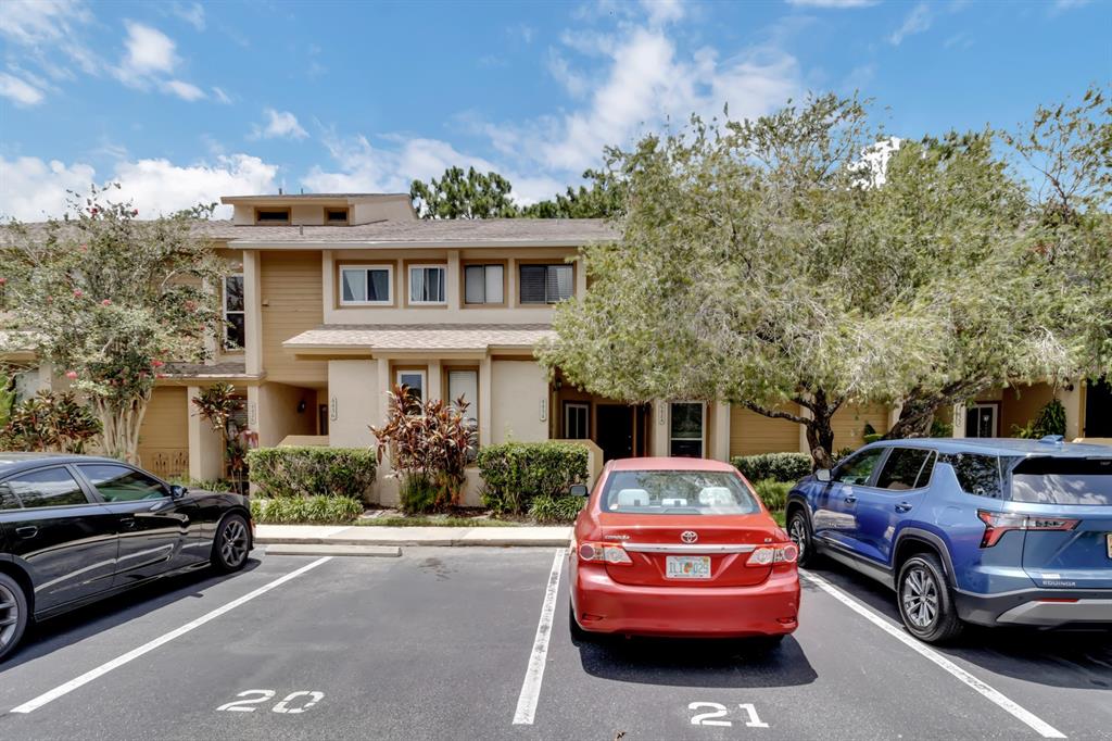 4434 Middlebrook Road, Unit 4 Orlando, FL 32811 - Photo 1 of 31 a front view of a house with parking