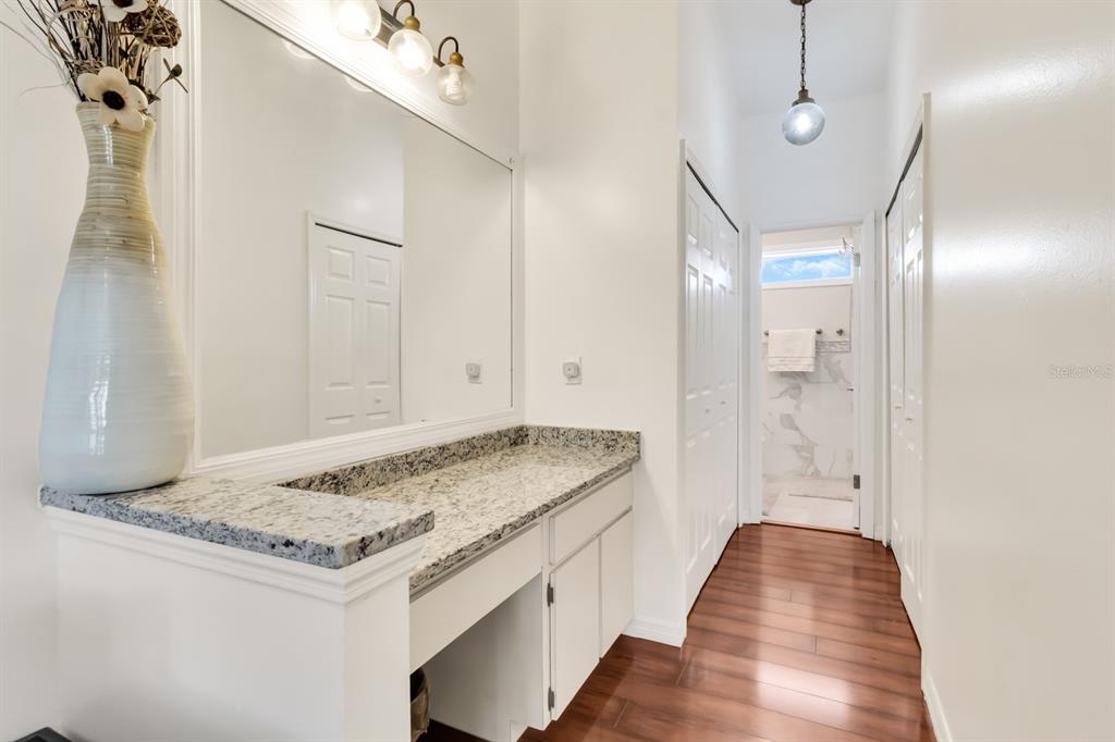 4434 Middlebrook Road, Unit 4 Orlando, FL 32811 - Photo 21 of 31 a bathroom with a granite countertop sink and a mirror