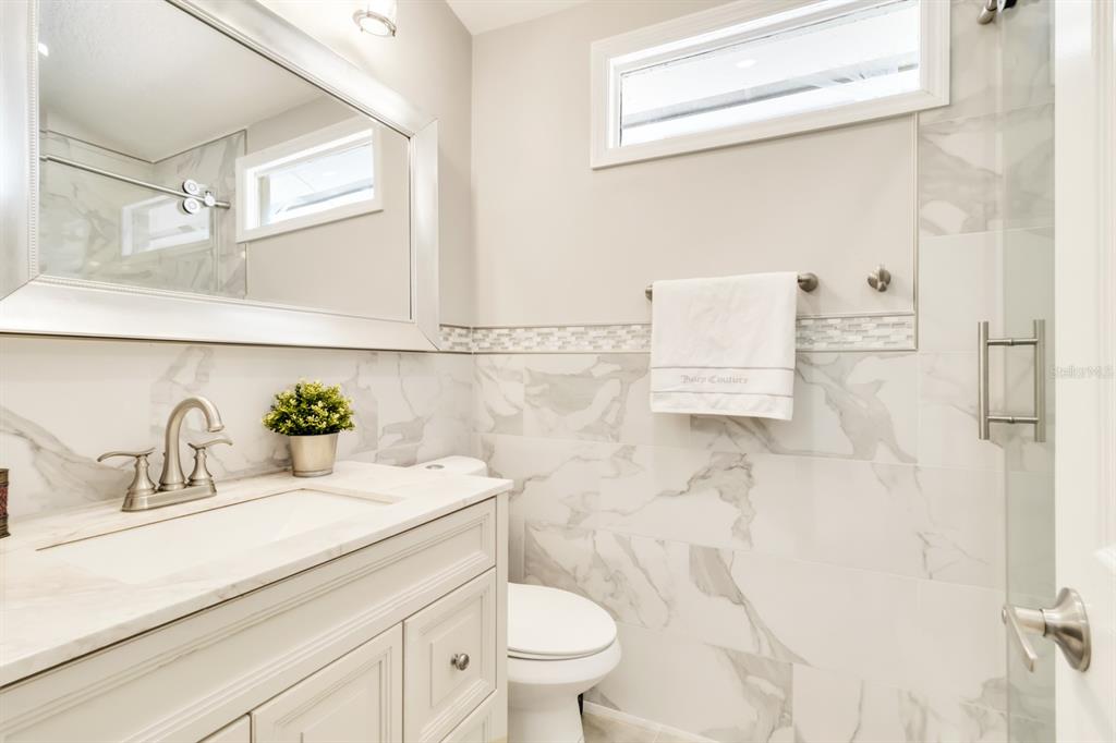4434 Middlebrook Road, Unit 4 Orlando, FL 32811 - Photo 24 of 31 a bathroom with a sink a toilet and a shower