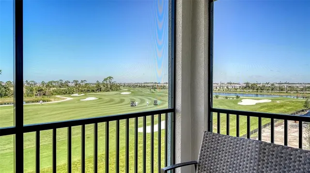 a bedroom with a bed and a television