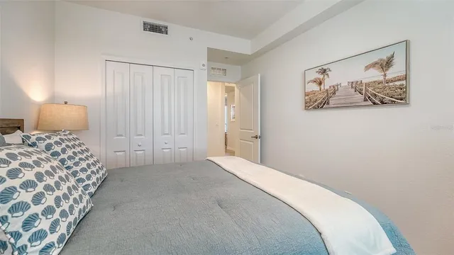 a bedroom with a bed and a sink